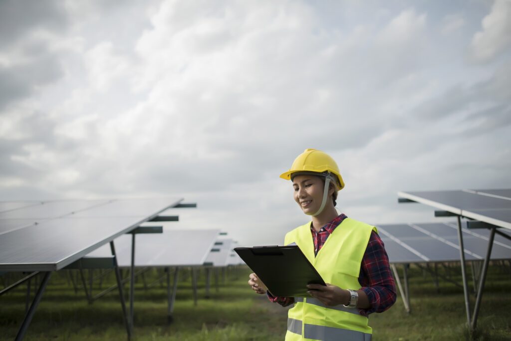 engineer electric woman checking and maintenance of solar cells .jpg