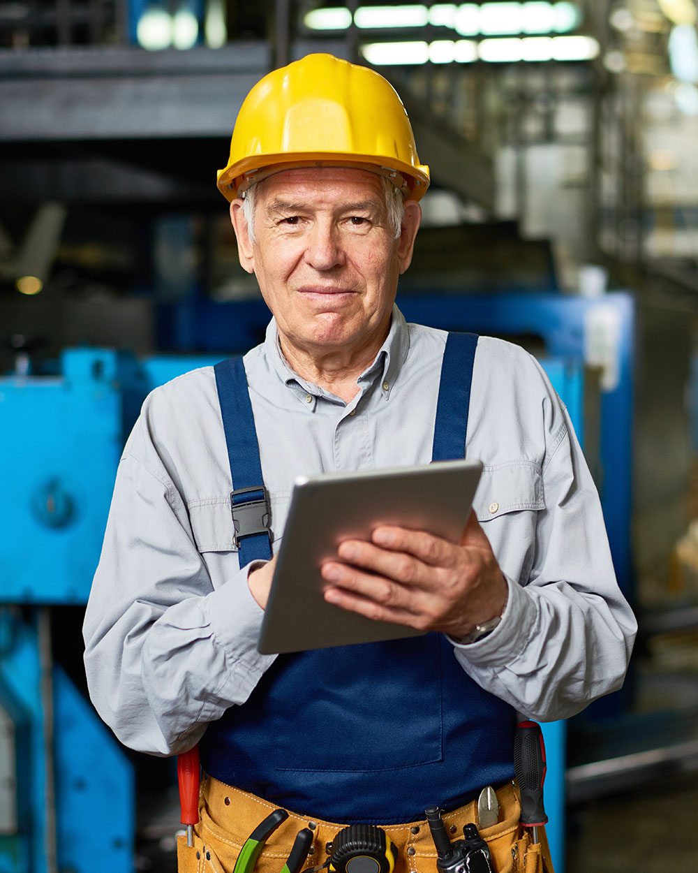 senior man working at modern factory tnq8ku3.jpg