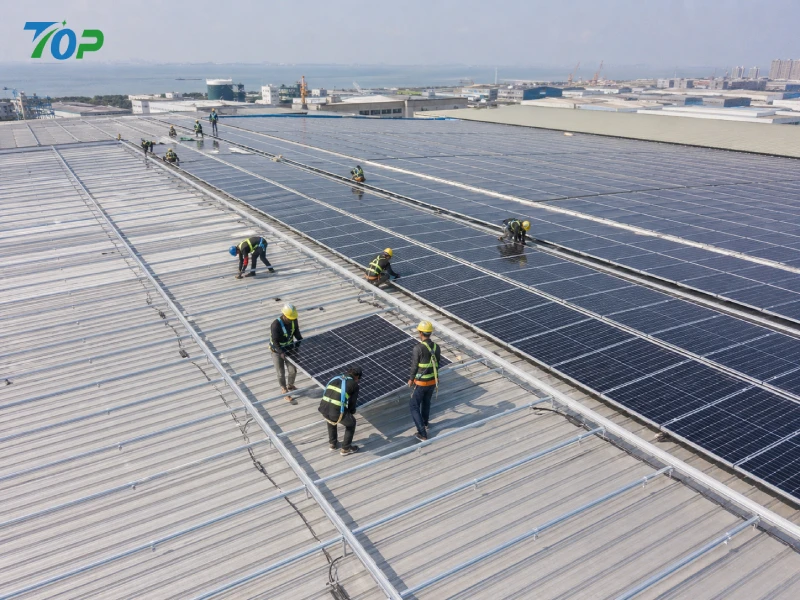 workers installing solar panels on rooftop using rail clamp system