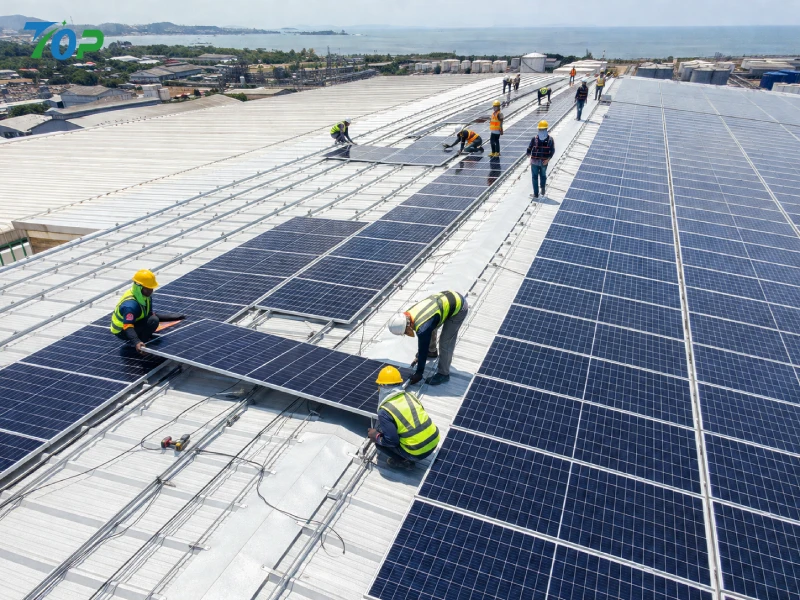 workers installing solar panels on rooftop using rail clamp system
